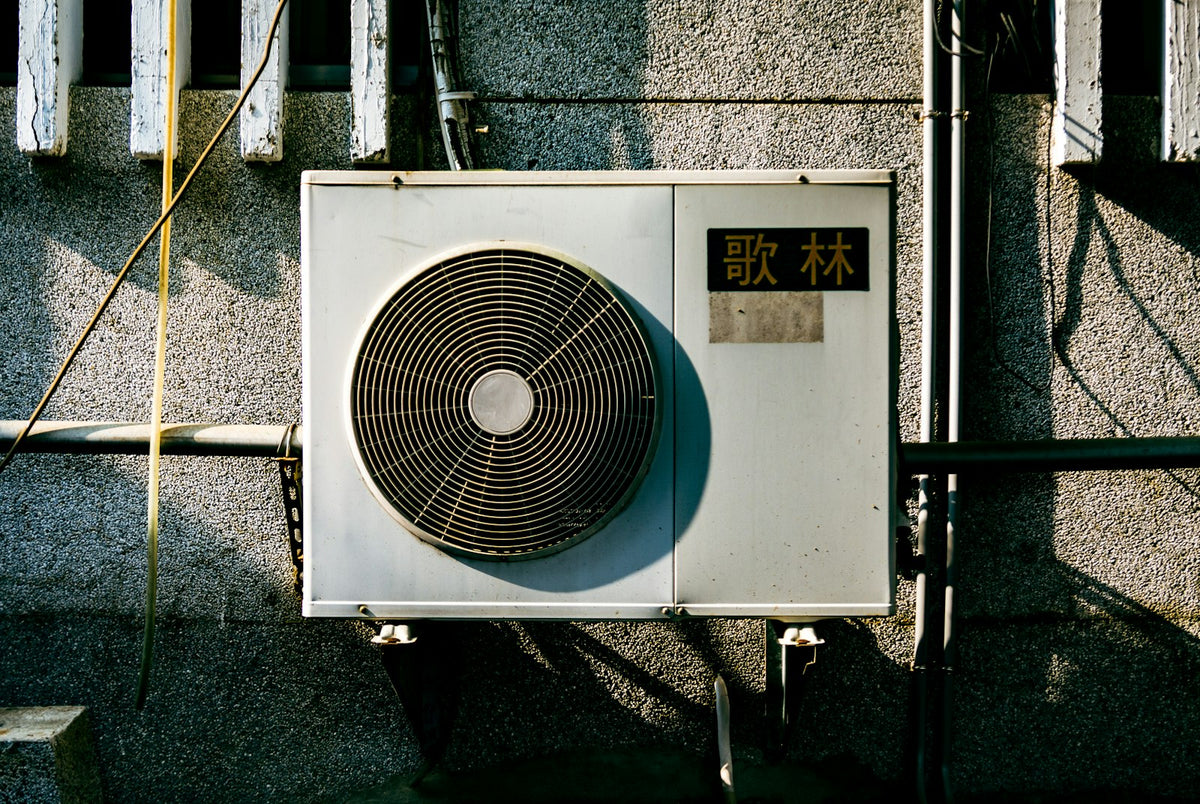 Wall mounted air conditioner on the side of a building
